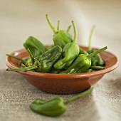Baby green peppers in a dish