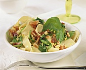Ribbon pasta with bacon, spinach and pine nuts