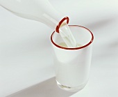 Pouring buttermilk into a glass