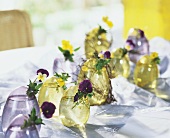 Glass Easter egg vases with horned violets & pansies