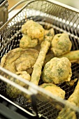 Vegetable pakoras in frying basket