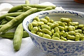 Bowls of Fresh Pea Pods with Peas