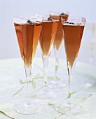 Red champagne with lavender in square glasses