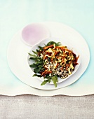 Rice salad with fried courgette, carrots and tomatoes