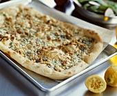 Rustic pear pizza with blue cheese and nuts