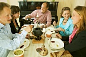 Young people eating fondue