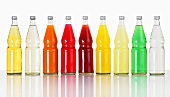 Several bottles of different fizzy drinks