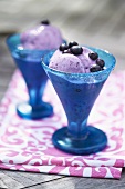 Blueberry ice cream in two sundae glasses