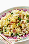 Pan-cooked rice dish with ham and peas