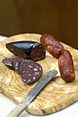 Black pudding and chorizo on a wooden board