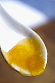 Apricot jam on a spoon