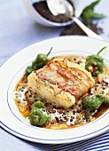 Cod wrapped in bacon with lentil sauce
