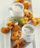 Cauliflower fritters with herb and egg sauce