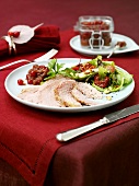 Roast ham with cranberries and salad