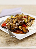 Beef with pepper sauce and mushrooms