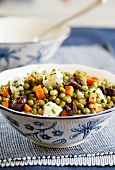 Pea and carrot salad with feta and olives