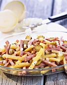 Cheese and sausage salad with gherkins