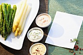 Green and white asparagus with three sauces