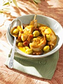 Braised rabbit with olives and bacon
