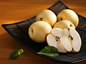 Nashi pears in a metal dish