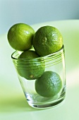 Four limes in a glass