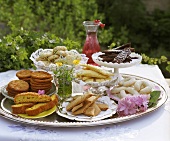 Assorted cakes and biscuits on silver tray