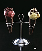 Strawberry ice cream & vanilla ice cream in chocolate cones
