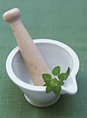 Mortar and pestle with Thai basil