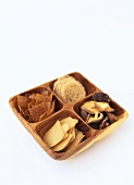 Crackers & shiitake mushrooms in a wooden dish