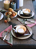 Laid table with lighted candles