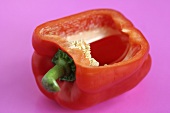 A red pepper with a slice removed