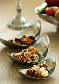 Assorted sweets and chocolates in small bowls
