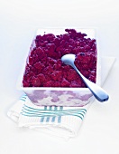Berry sorbet in a plastic container