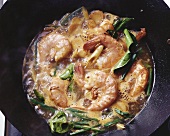 Shrimp soup simmering in a wok