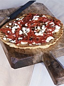 Peppers and goat's cheese on pizza base