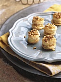 Small puff pastries with Camembert filling and walnuts