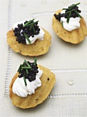 Sweet corn madeleines with sour cream and caviar