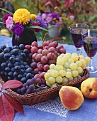 Basket of grapes with pears in foreground