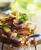 Lard with crackling, meat and gherkins on wholemeal bread