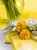 Easter place-setting with flowers and napkin
