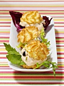 Savoury profiteroles filled with soft cheese and olives