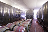Stainless steel tanks and wooden barrels at a winery