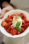 Marinated strawberries with basil and vanilla ice cream