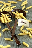 Penne with ladle and skimmer