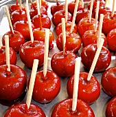 Toffee apples on a baking tray
