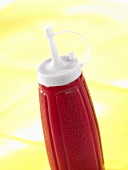 Red plastic ketchup bottle