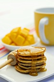 Pancakes with honey and mango