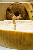 Parmigiano-Reggiano (whole cheese) with cheese knife