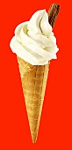 Cone of soft vanilla ice cream with chocolate flake