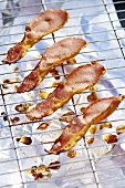 Rashers of fried bacon on a rack